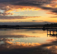 Reflections on Merimbula Lake - Tourism Noosa